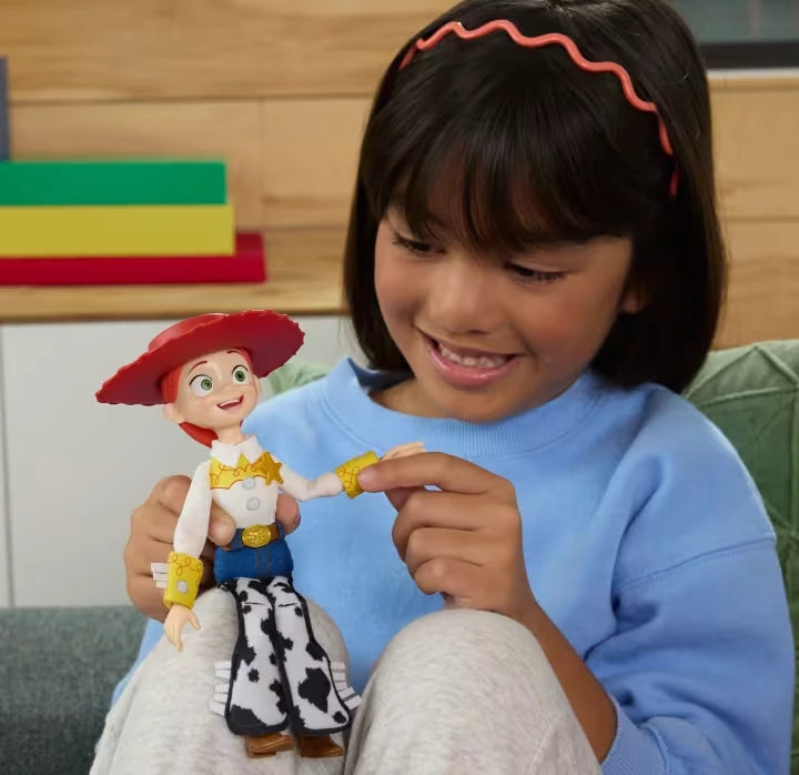 Toy Story 5 Jessie held by a child with red hat, cow print chaps and gold sheriff badge