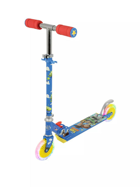 Front side view of the Toy Story inline scooter showing blue alien-printed stem, red foam grips with sheriff star end caps, Toy Story character deck graphic and two light-up yellow inline wheels