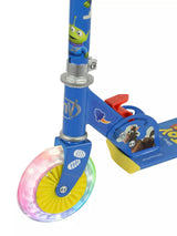 Close-up of the Toy Story scooter front wheel showing multicolour LED lights illuminated through a yellow hub, with red rear brake and Bullseye character graphic on the deck visible