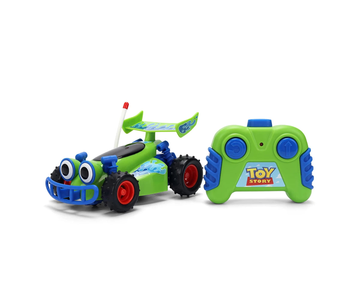 Toy Story RC Turbo Buggy with green body, large cartoon eyes, blue front bumper, red wheel rims and matching green remote controller with blue buttons.