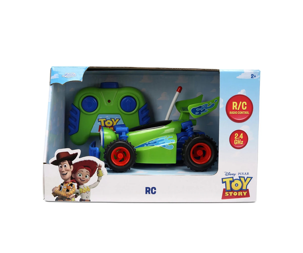 Toy Story RC Turbo Buggy retail packaging showing the green car and matching controller, Woody and Jessie artwork, 2.4 GHz radio control branding and 2+ age marking.