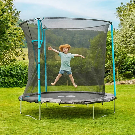TP Up 8ft trampoline with child bouncing inside the safety enclosure on grass