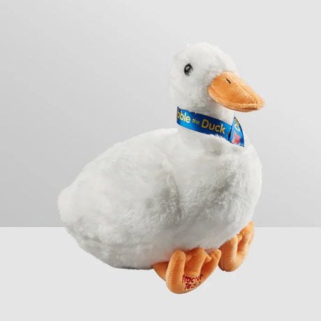 Tractor Ted Dibble The Duck Soft Toy front angle view showing white plush body, orange beak and feet, and blue ribbon collar