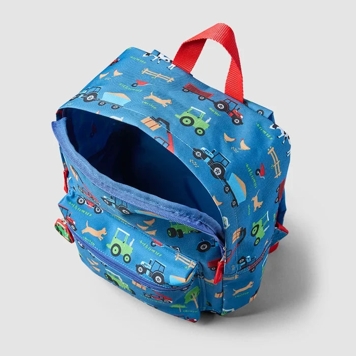 Angled side of the blue Tractor Ted Farmyard Rucksack showing its side panel, colourful farm print and red carrying handle.
