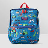 Front of the blue Tractor Ted Farmyard Rucksack showing colourful tractors, cows, chickens, farm machinery, Tractor Ted logo, zipped front pocket and red carrying handle.