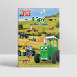 Tractor Ted I Spy on the Farm Book front cover showing green Tractor Ted character with magnifying glass and farm scene illustration