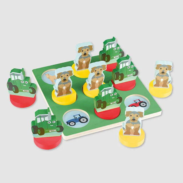 Tractor Ted wooden Tic Tac Toe board with Tractor Ted and Midge wooden playing pieces arranged on a table