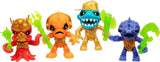 Four Treasure X Shark Dissection collectible figures in red, orange, gold and blue, each with green weapon accessories and detailed character designs