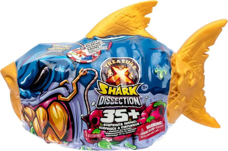 Treasure X Shark Dissection in gold shark-shaped packaging with blue printed wrap, showing 35+ surprises inside, Dissect and Rescue feature and age 5+ rating