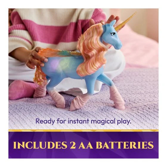 Child playing with Unicorn Academy Glow Magic Skywind on a bed