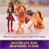 Unicorn Academy Valentina doll standing beside Cinder with a red bridle, gold breastplate, red gemstone and translucent orange wing, demonstrating Cinder's Fire Magic feature.