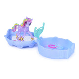 Purple unicorn figure with rainbow mane standing in an open blue tray beside a turquoise accessory