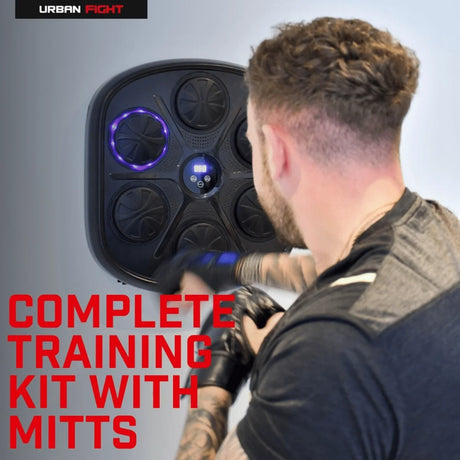 Man training with Urban Fight Bluetooth Boxing Machine on wall in Ireland