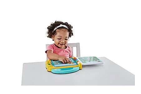 Child using VTech 100 Things That Go bilingual learning book – Ireland