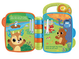 VTech Animal Rhymes Storytime open book showing farm scene with dog, sheep, cow and cat illustrations and printed rhyme text