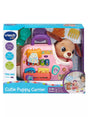 VTech Baby Cutie Puppy Carrier in retail box showing pink carrier with plush puppy, numbered keys, and role-play accessories for ages 9 to 36 months