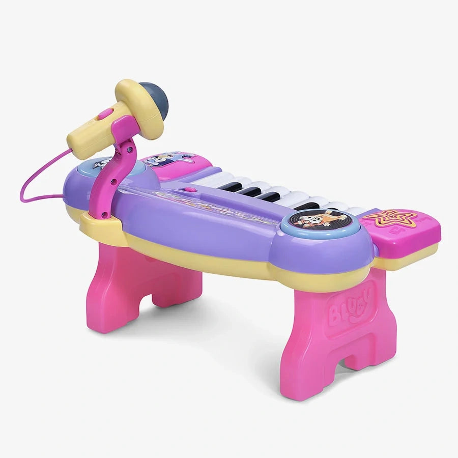 VTech Bluey Sing-Along Keyboard showing purple body, pink legs, yellow microphone and piano keys