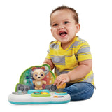 Baby playing with VTech DJ Jams Puppy music toy and microphone – Ireland.
