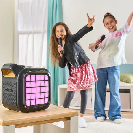 Children singing with VTech Karaoke Light Party speaker showing glowing pixel lights – Ireland.