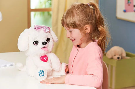 Child playing with VTech Kosy The Kissing Puppy interactive plush toy in Ireland