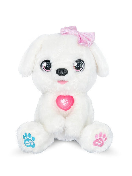 Close-up of VTech Kosy The Kissing Puppy plush with bow and glowing heart charm in Ireland