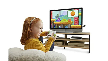 Child playing LeapLand Adventures video game on TV with wireless controller – Ireland