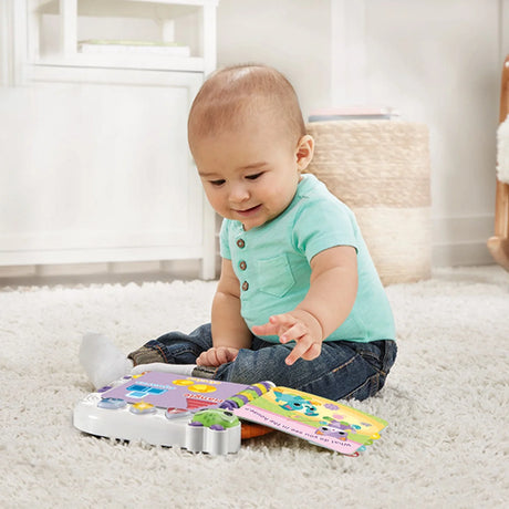 Baby playing with VTech Learn and Discover Baby Book on the floor – Ireland