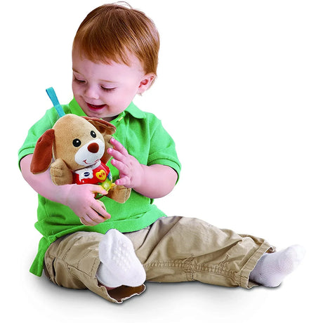 Child playing with VTech Little Singing Puppy toy on floor Ireland