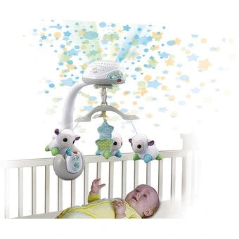 VTech Lullaby Lambs Mobile attached to cot above baby with star projection on the wall