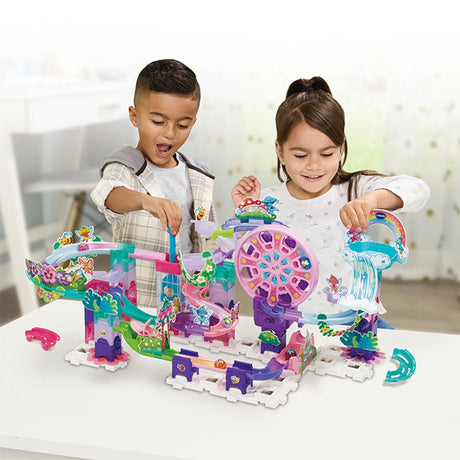 Two children playing with the VTech Marble Rush Petal Power marble run on a tabletop at home – Ireland.