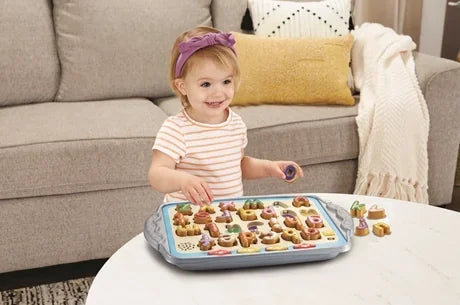 Toddler playing with VTech Match and Learn Biscuits tray toy – Ireland