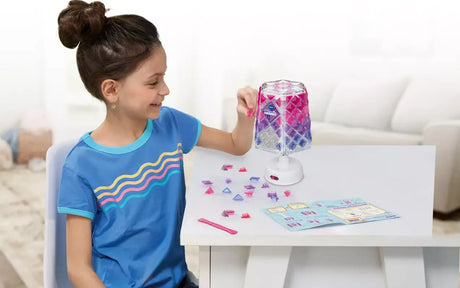 Child playing with VTech Mosaic Magic Lights lamp and tiles – Ireland.
