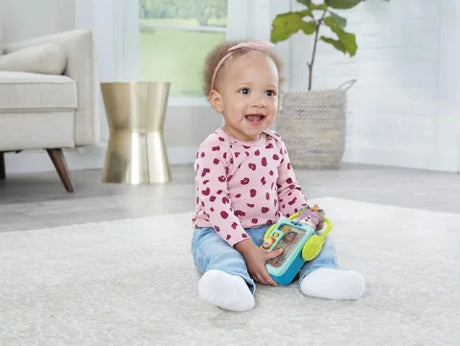 Baby playing with VTech Musical Spin and Play Kitty Toy – Ireland