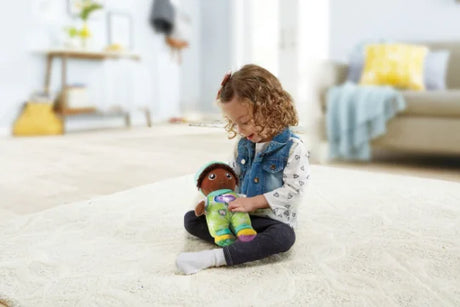 VTech My 1st Doll Mia plush toy being cuddled by toddler on carpet, Ireland
