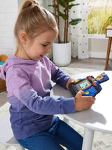 Child seated at a table playing with the VTech PAW Patrol Chase Game & Go