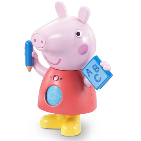 Peppa Pig Move and Learn figure holding blue pencil and ABC book with light-up tummy button – Ireland.