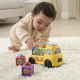 Baby playing with VTech Pop-a-Block Truck and removable animal blocks – Ireland.