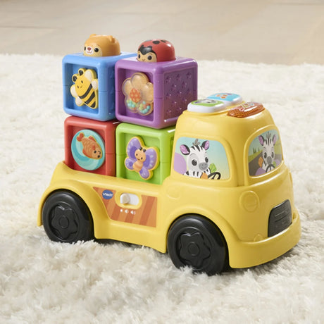 Side view of VTech Pop-a-Block Truck with zebra driver and stacked blocks – Ireland.