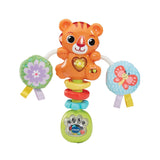 Close view of VTech Rattle & Roar Tiger with heart panel illuminated, green slider switch visible and beads inside transparent base