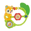 VTech Shaking Sounds Bear Rattle showing yellow bear on green ring with red flower spinner, green leaf teether, three sliding rings and music note button