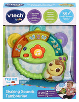 VTech Shaking Sounds Tambourine inside retail packaging showing VTech baby branding, 3 to 24 months label and 35 plus songs badge