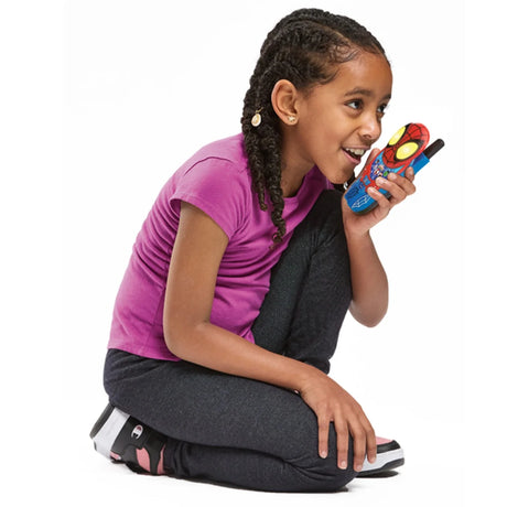 Child using a VTech Spidey-Sense Walkie-Talkie during pretend play, speaking into the handset – Ireland.