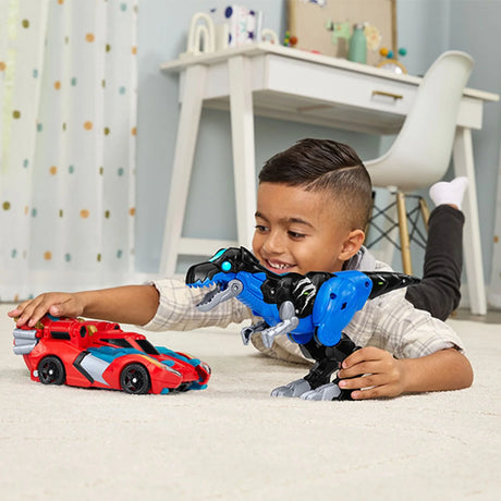 Child playing with VTech Switch & Go Dinos Armour Up Dragon T-Rex and red super car on a carpet – Ireland.