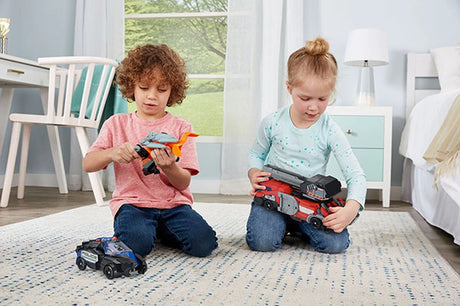Two children sitting with VTech Switch & Go Dinos Rescue Raiders 3-in-1 rescue vehicles