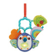 VTech Take Along Toucan soft toy with blue and white toucan face, light up heart on chest, crinkly wings, orange butterfly, green leaf with ladybird and turquoise hanging ring