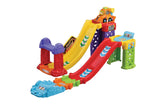 VTech Toot Toot 3 in 1 Raceway assembled in stunt raceway layout with steep yellow ramp, red return ramp and orange SmartPoint racer at top platform