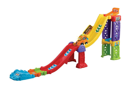 VTech Toot Toot 3 in 1 Raceway assembled in dual raceway layout with yellow and red ramps, purple and green supports and orange SmartPoint race car on track