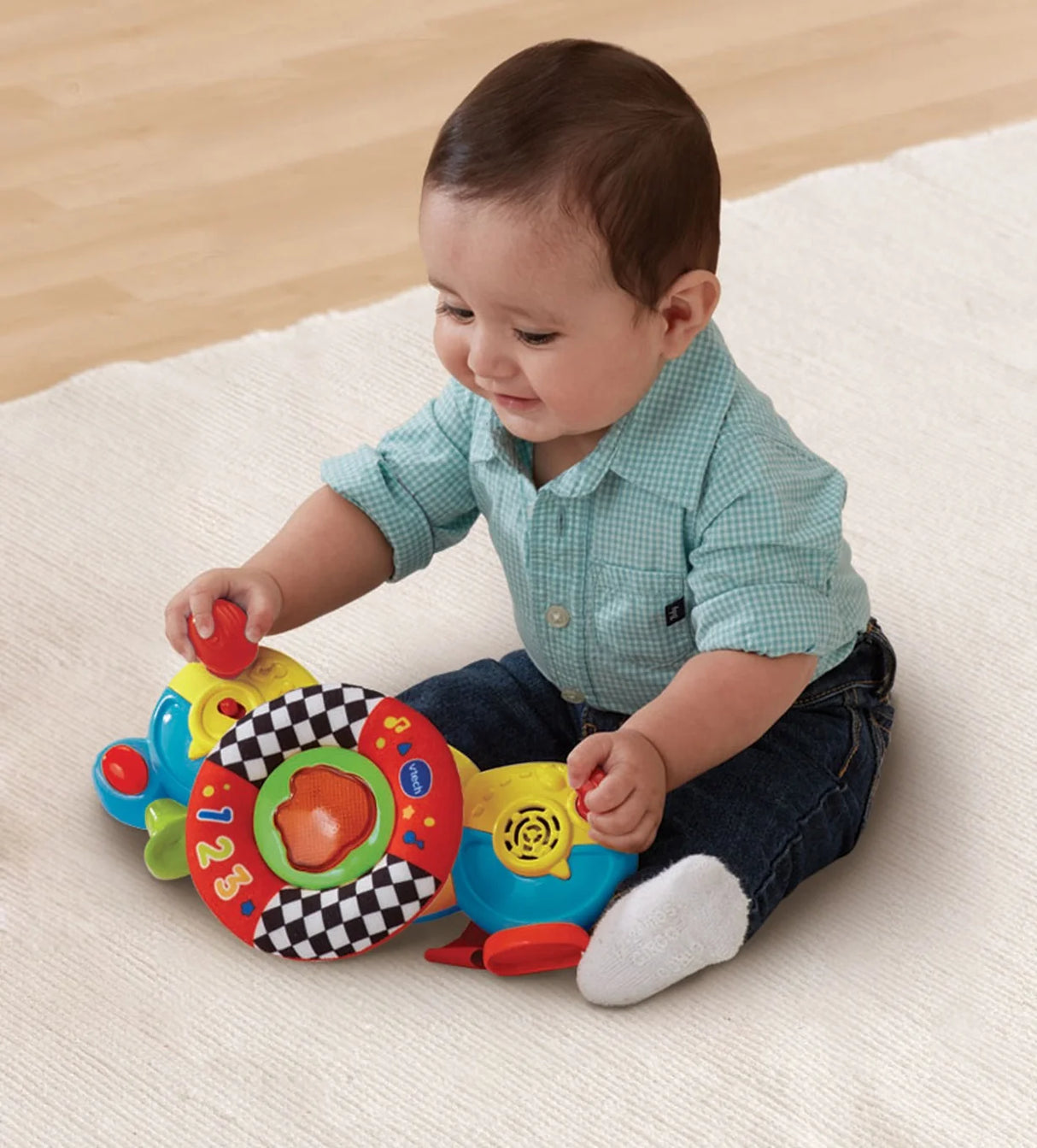 Baby playing with VTech Toot-Toot Drivers Baby Driver toy on floor – Ireland