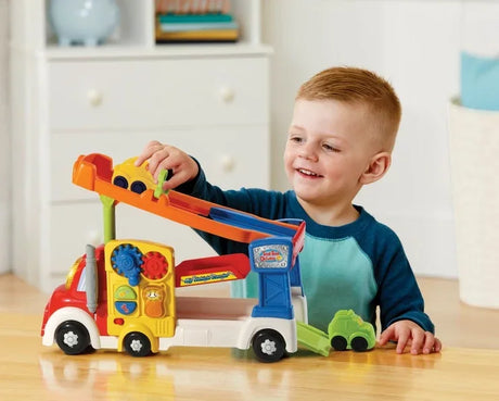 Child playing with VTech Toot Toot Drivers Big Vehicle Carrier toy ramp – Ireland