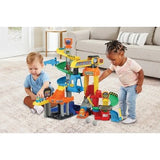 Children playing with the VTech Toot-Toot Drivers Construction Site, spiral track, crane and Dumper Truck